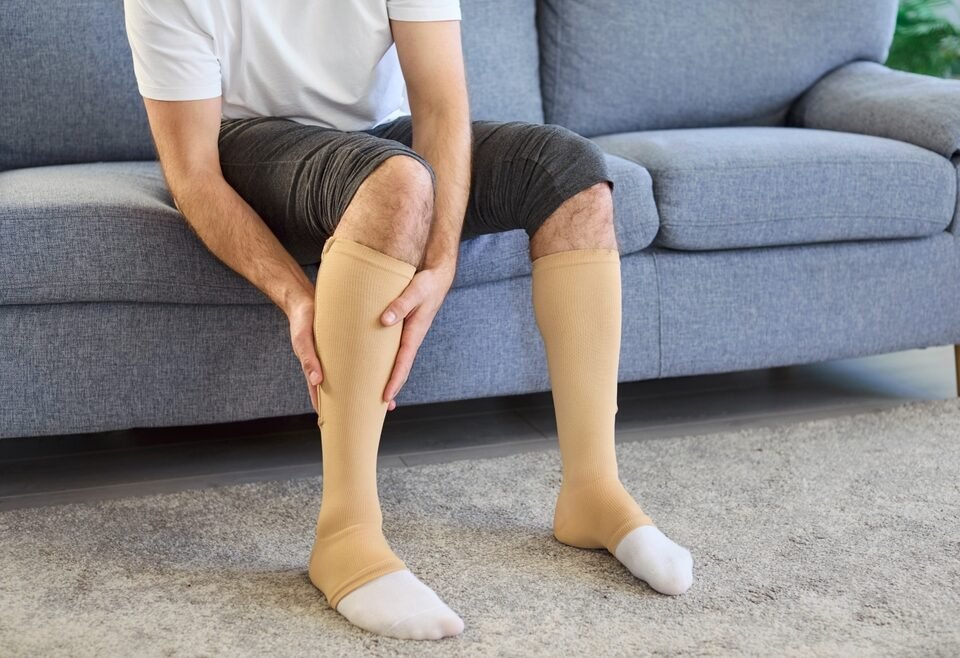 Alt text: Patient recovering after varicose vein treatment. 